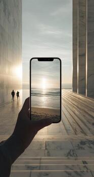 A person holding up a smartphone with a photo of the ocean