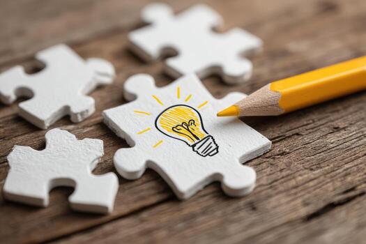 Idea light bulb on puzzle pieces photo