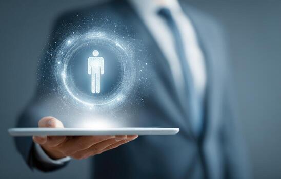 Businessman holding tablet with man icon on it photo