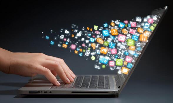 A person is typing on a laptop with social icons coming out of it photo