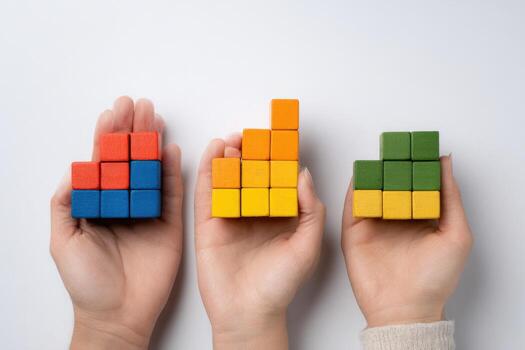 Hands holding colorful cubes on white background photo