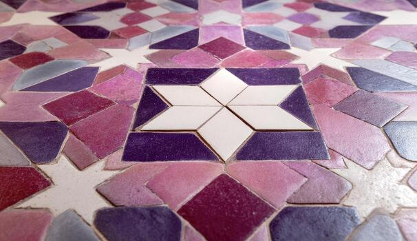 A close up of a tile with a star on it photo