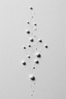 A white wall with many small dots on it photo