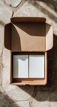 A cardboard box with two blank cards inside photo