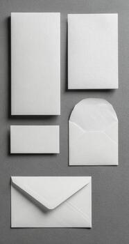 White envelopes, paper and envelope on gray background photo