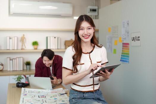 Young Designer Using Tablet for UX UI Project photo