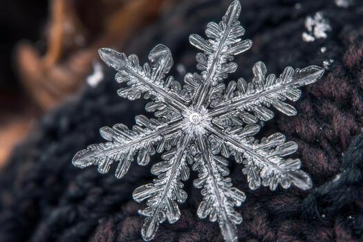 A detailed snowflake rests delicately on a dark woolen glove, showcasing intricate patterns and symmetry. The image captures the beauty of winters unique creations in stunning clarity photo