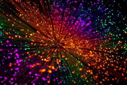 Bright particles burst outward in a captivating display of colors against a dark background. This scene evokes energy and movement, capturing attention with its lively patterns photo