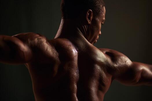 A dancer showcases their powerful physique in a captivating display of grace and strength. The close-up highlights the intricate muscle definition essential for ballet performance at a studio photo