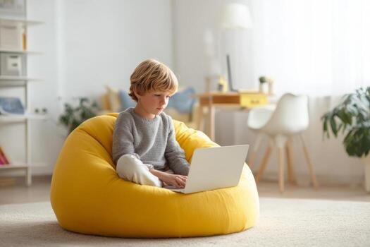 A young child sits on a vibrant beanbag in a well-lit living room, focusing intently on a laptop streaming an online language class, enhancing language skills through technology photo