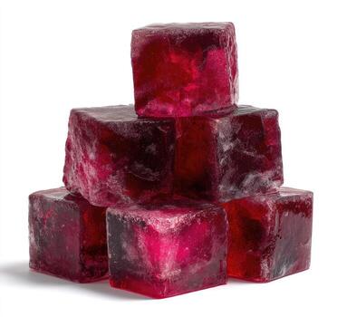 Six ruby-toned, translucent cubes stacked irregularly against a white backdrop photo