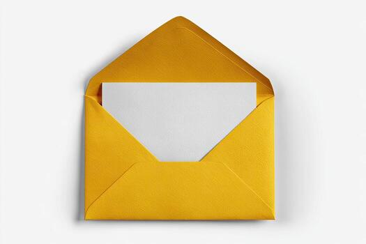 Top-down view of a golden envelope opened, revealing a blank white rectangular card photo