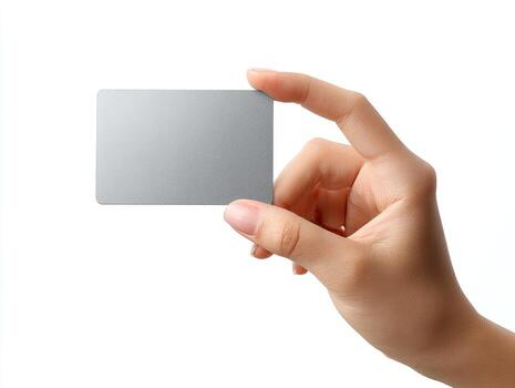 A hand holds a rectangular gray card against a white backdrop, showcasing fingers and details photo