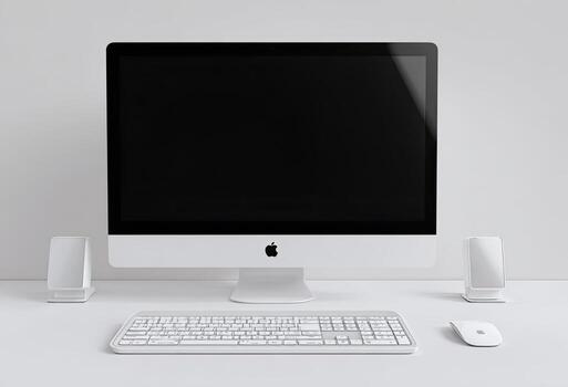 A sleek desktop computer setup with a large monitor, keyboard, mouse, and speakers photo