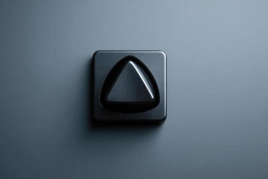 un mate negro, cuadrado botón con un triangular forma saliente foto