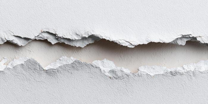 Ripped white plaster texture showing a horizontal tear photo