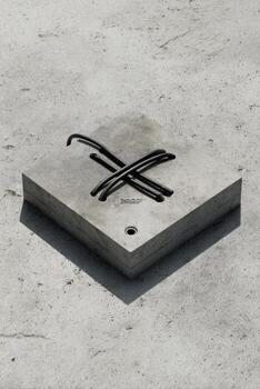 Square concrete block with embedded wires photo