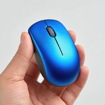 Close-up of a hand holding a small, bright blue wireless computer mouse photo