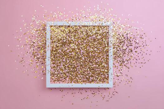 A white square frame centered on a pink surface, filled with gold glitter photo
