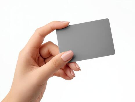 A hand holding a gray rectangular card, isolated on a white background photo