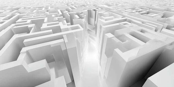 A stark, perspective view of a complex, white, geometric maze, with a bright path photo
