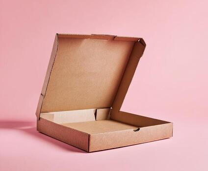 Empty open brown cardboard pizza box sits on pink background, lit with soft light photo