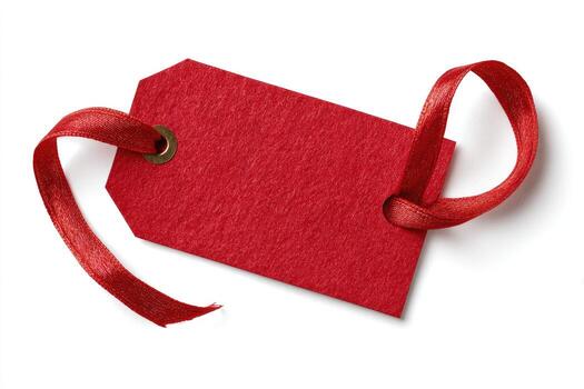 A close-up of a red tag with a looped red ribbon and a metal eyelet, isolated on white photo