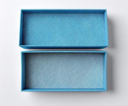 Top-down shot of an open, rectangular, blue box, its lid separated photo
