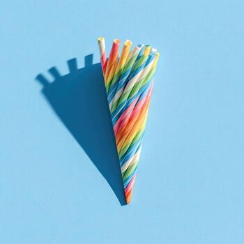 Colorful candy twist arranged like an ice cream cone with a long shadow photo