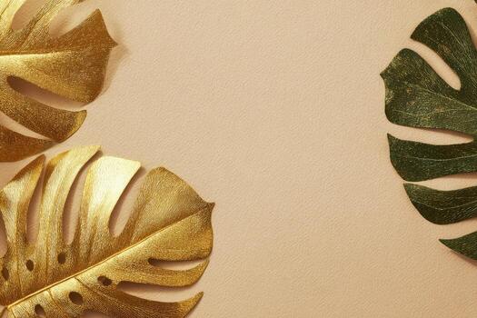 Tropical leaves, some gilded, on a neutral beige background, creating an elegant composition photo