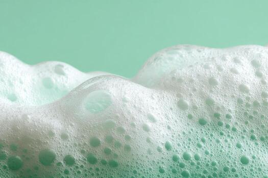 Beauty Product Foam Soap. Abstract background white soapy foam flowing texture. Shampoo foam with bubbles. Bubble surface isolated on a green color. Chroma key. Suds. Facial cleanser. Froth Pattern. photo