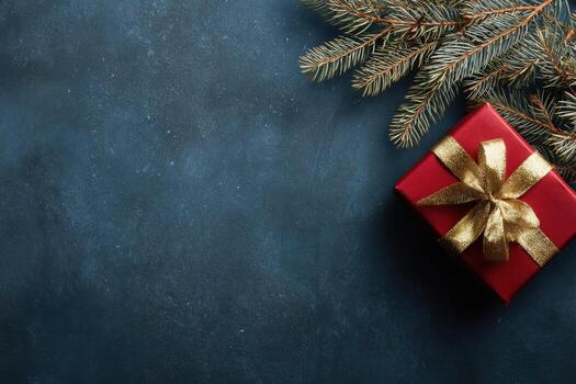Christmas and New Year blue background with decoration. Table top view. Christmas tree branches, Red gift box with a golden ribbon, stars, and balls. Copy space for text on the side. Flat lay mock-up photo
