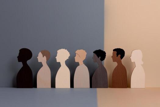 Diverse Human Wooden Silhouettes Variety. Inclusivity, Unity, Acceptance of All. Diversity and inclusion. People Figurines Standing in a Row. Unity, representation within society. Close to each other photo