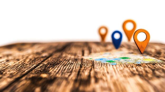 Wooden Map Pins on a Table with a Colorful Map, Focused on Location and Navigation photo