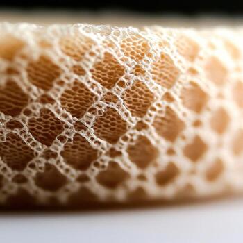 Close-Up of Delicate Lace Texture with Intricate Pattern on Soft Fabric Surface photo