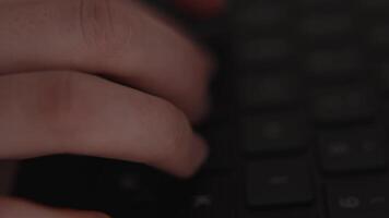 Close-up of hands typing on laptop keyboard, symbolizing digital work, office productivity, and modern computer technology in business and communication video