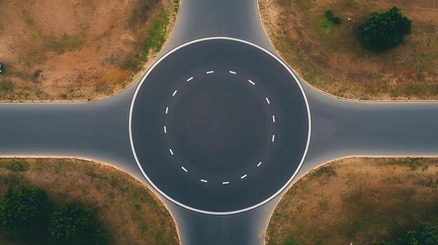 Aerial View of a Circular Intersection with Roundabout Sign for Smooth Traffic Flow photo