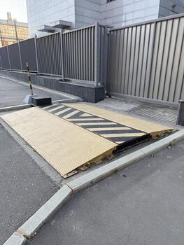 Automated car parking barrier in urban setting, emphasizing modern infrastructure design photo
