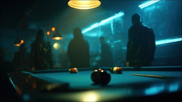 Moody shot of a pool table, illuminated by overhead lights, with blurry figures in the background photo