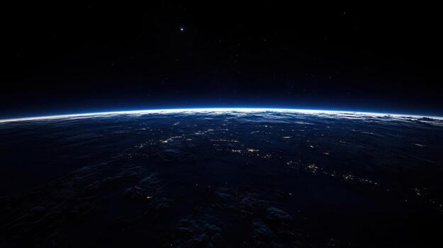 A breathtaking, high-altitude view of Earth's nocturnal curvature, showcasing a thin atmospheric layer above a dark, city-lit landscape and a star-studded black void beyond photo