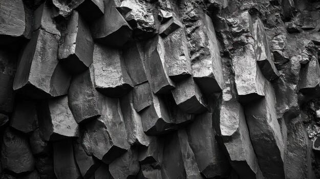 Close-up view of dark basalt rock formations photo