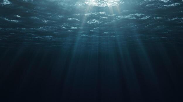 Sunbeams penetrate a deep, dark ocean, illuminating a cloudy, ethereal underwater scene. The light creates a dramatic contrast between the dimly lit depths and the brighter upper layers photo