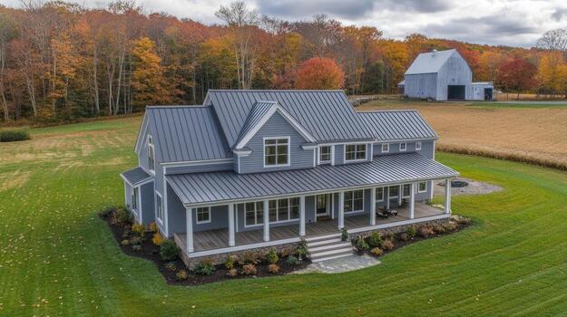Aerial view of a modern farmhouse with a large porch photo
