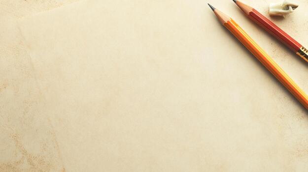 Two pencils on aged paper photo