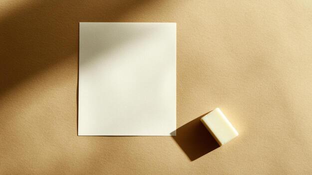 Blank paper and bar of soap on beige surface photo