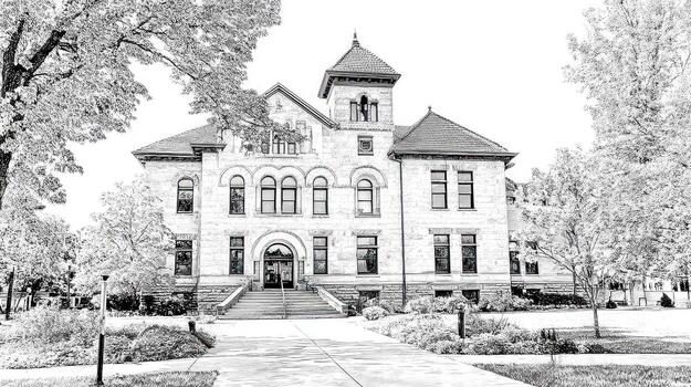 Ornate stone building with a tower, framed by trees in black and white photo