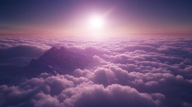 Sunrise over a mountain range veiled in clouds photo