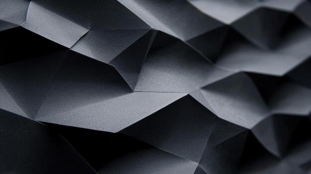 Abstract geometric pattern of dark gray folded shapes photo