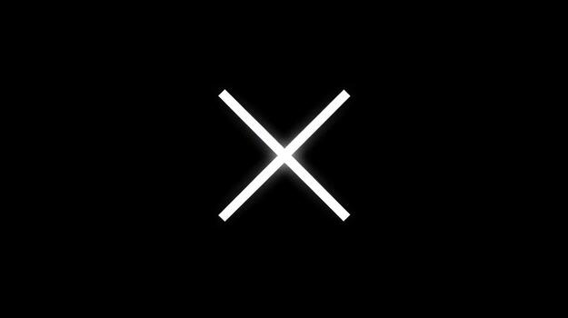 A simple, bright white cross on a black background photo