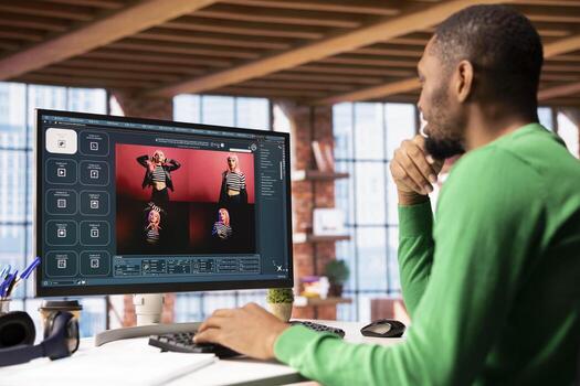 Man in apartment workspace using AI software on computer turning text prompt into photos. Person in brick wall home office uses text to image generative models on PC monitor photo